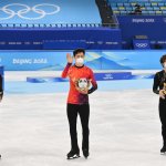 Gold medalist Nathan Chen of Team United States (C), Silver medalist Yuma Kagiyama of Team Japan (L), and Bronze medalist Shoma Uno of Team Japan (R) pose during the Men Single Skating flower ceremony on day six of the Beijing 2022 Winter Olympic Games at Capital Indoor Stadium on February 10, 2022 in Beijing, China.