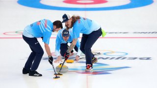 John Landsteiner, John Shuster and Matt Hamilton of Team United States compete against Team Switzerland during the Men’s Curling Round Robin Session 9 on day 11 of the 2022 Winter Olympics at National Aquatics Centre on Feb. 15, 2022, in Beijing, China.