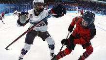 Jocelyne Larocque #3 of Team Canada and Jesse Compher #18 of Team United States compete during the Women's Ice Hockey Gold Medal match between Team Canada and Team United States at the 2022 Winter Olympic Games, Feb. 17, 2022, in Beijing, China.