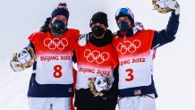 (L-R) Silver medalist David Wise of Team United States, gold medalist Nico Porteous of Team New Zealand and bronze medalist Alex Ferreira of Team United States celebrate during the Men's Freestyle Skiing Halfpipe flower ceremony on day 15 of the Beijing 2022 Winter Olympics at Genting Snow Park on Feb. 19, 2022, in Zhangjiakou, Hebei Province of China.