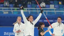 Eve Muirhead of Team Great Britain raises her arms in celebration after defeating Team Japan in the Women's Gold Medal match between Team Japan and Team Great Britain at National Aquatics Centre on Feb. 20, 2022, in Beijing, China.