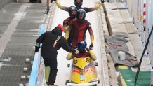 Johannes Lochner, Florian Bauer, Christopher Weber and Christian Rasp of Team Germany celebrate their silver medal finish in the four-man Bobsleigh heat 4 on day 16 of 2022 Winter Olympics at National Sliding Centre on Feb. 20, 2022, in Yanqing, China.