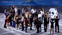 Competitors interact with mascot Bing Dwen Dwen following the Figure Skating Gala Exhibition on day 16 of the 2022 Winter Olympics at Capital Indoor Stadium on Feb. 20, 2022, in Beijing, China.