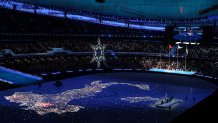 A map of Italy is reflected during the 2022 Winter Olympics Closing Ceremony, Feb. 20, 2022, in Beijing, China. Italy will be the next country to host the Winter Olympic Games in 2026.