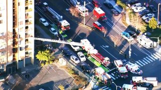 Firefighters at the scene of a fire at a residential tower in Oakland.