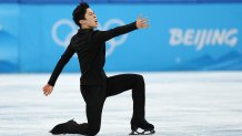 Nathan Chen mouth open arm out to the right