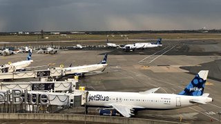 JetBlue planes at New York’s John F. Kennedy International Airport