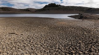 A cracked lake bed at Nicasio Reservoir during a drought in Nicasio, California, on Wednesday, Oct. 13, 2021.