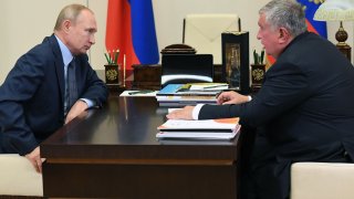 Russian President Vladimir Putin meets with Russia’s oil giant Rosneft CEO Igor Sechin at the Novo-Ogaryovo state residence outside Moscow on August 18, 2020.