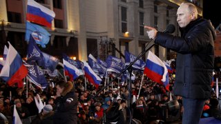 Russia’s Prime Minister Vladimir Putin addresses a rally at the Manezhnaya Square just outside the Kremlin in Moscow, late on March 4, 2012.