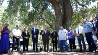 Assemblyman James Ramos, D-Highlands, of the San Manuel Band of Mission Indians, fifth from left, opens a meeting with tribal leaders from around the state, attended by Gov. Gavin Newsom, fourth from left, at the future site of the California Indian Heritage Center in West Sacramento, Calif
