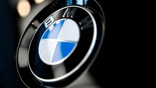 FILE- The logo of BMW is shown on a BMW car on March 20, 2019 in Munich, Germany. BMW is recalling more than 917,000 cars and SUVs in the U.S., Wednesday, March 9, 2022, most for a third time _ to fix a problem that can cause engine compartment fires. The recall covers many 3 Series, 5 Series, 1 Series, X5, X3, and Z4 vehicles from 2006 through 2013.