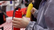 The controllers for "Plinko Burger" include these ketchup and mustard squeeze bottles and a drive-thru headset that players shout into.