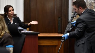 KENOSHA, WISCONSIN – NOVEMBER 08: Heather Williams, a firearms and tool mark examiner, identifies the rifle Kyle Rittenhouse used on Aug. 25, 2020, as Kenosha Police Department Detective Ben Antaramian at the Kenosha County Courthouse on November 8, 2021 in Kenosha, Wisconsin. Rittenhouse is accused of shooting three demonstrators, killing two of them, during a night of unrest that erupted in Kenosha after a police officer shot Jacob Blake seven times in the back while being arrested in August 2020. Rittenhouse, from Antioch, Illinois, was 17 at the time of the shooting and armed with an assault rifle. He faces counts of felony homicide and felony attempted homicide.