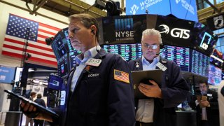 A trader works on the floor of the New York Stock Exchange (NYSE) in New York City, U.S., March 16, 2022.