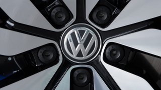 FILE – An e-Golf electric car with the VW logo on a rim is pictured in the German car manufacturer Volkswagen Transparent Factory (Glaeserne Manufaktur) in Dresden, eastern Germany, April 28, 2017.
