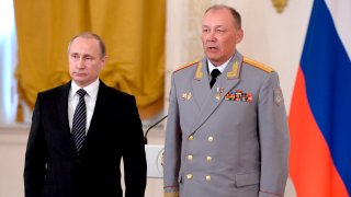 In this photo taken on March 17, 2016, Russian President Vladimir Putin, left, poses with Col. Gen. Alexander Dvornikov during an awarding ceremony in Moscow’s Kremlin, Russia.