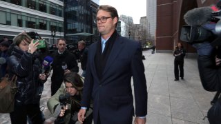 Mark Riddell departs federal court Friday, April 12, 2019, in Boston, after pleading guilty to charges in a nationwide college admissions bribery scandal.