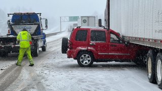 Crews work at the scene of a crash on Interstate 80 in the Sierra Nevada.