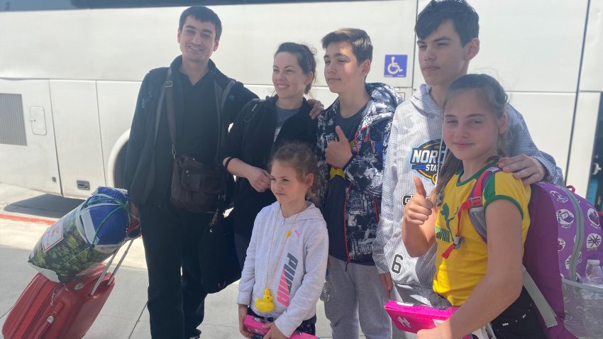 Mark a 15 year old refugee pictured with his family shared how his family of six left their war torn city which is now occupied by Russian forces.