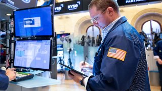 Traders on the floor of the NYSE, April 28, 2022.