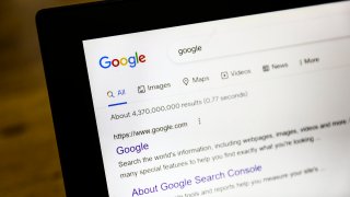 A computer displays Google search results.