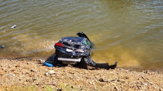A car at rest after plunging into Uvas Reservoir in Morgan Hill.