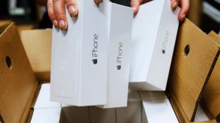 FILE - An Apple iPhone 6 phones are taken out of a shipping box at a Verizon store on September 18, 2014 in Orem, Utah.