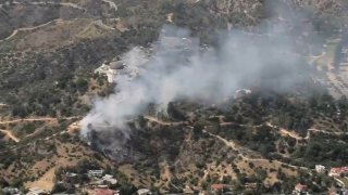 Smoke rises from a fire in Griffith Park Tuesday May 17, 2022.