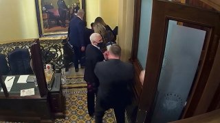 In this image from video, a security video shows Vice President Mike Pence being evacuated from near the Senate chamber as rioters breach the Capitol, on Jan. 6, 2021, at the Capitol in Washington.