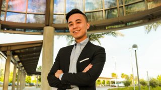 Alex Lee poses for a photo at the Warm Springs Bay Area Rapid Transit station in Fremont, Calif.