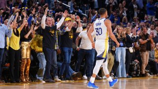 Golden State Warriors fans celebrate.