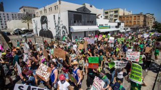 Protesters hold placards during a demonstration in downtown Los Angeles.