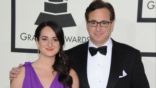 FILE - Comedian Bob Saget (R) and daughter Lara Saget arrive at the 56th GRAMMY Awards at Staples Center on January 26, 2014 in Los Angeles, Calif.