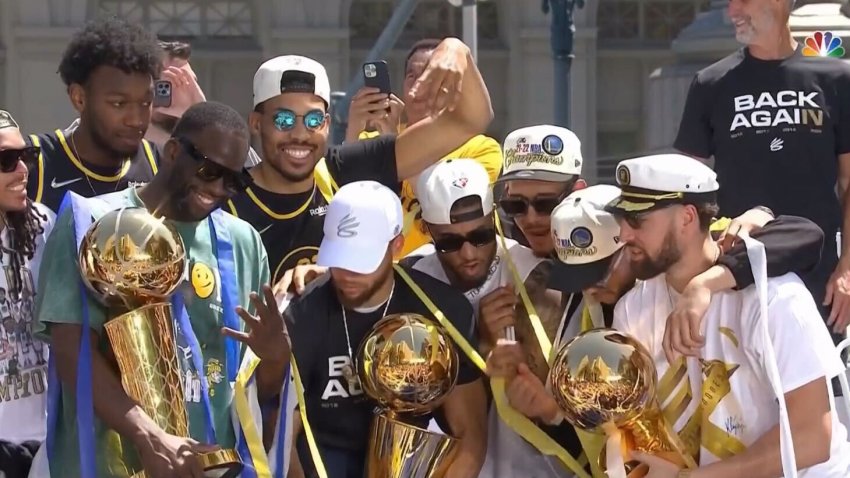 Golden State Warriors players celebrate their win in San Francisco Monday.