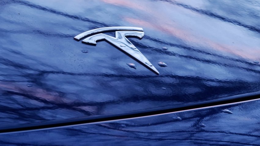 Tesla’s logo is seen on a Tesla.