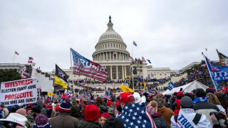 FILE – In this Jan. 6, 2021, file photo insurrections loyal to President Donald Trump rally at the U.S. Capitol in Washington. U.S. Capitol Police officers who were attacked and beaten during the Capitol riot filed a lawsuit Thursday, Aug. 26, against former President Donald Trump, his allies and members of far-right extremist groups, accusing them of intentionally sending insurrectionists to disrupt the congressional certification of the election in January.