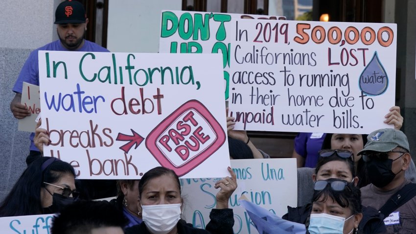 Demonstrators call for safe drinking water during a rally at the Capitol in Sacramento, Calif., on Tuesday, May 31, 2022. A report issued by state auditors, Tuesday, July 26, 2022, says that water out of the tap for more than 900,000 Californians lack access to clean water and the state isn’t acting fast enough help clean up those systems.