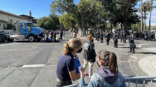 Police block off demonstrators from getting to People’s Park in Berkeley, which is closed for housing construction. (Aug. 3, 2022)