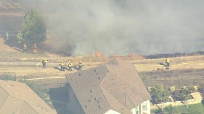Crews Battle Vegetation Fire Threatening Structures in the East Bay