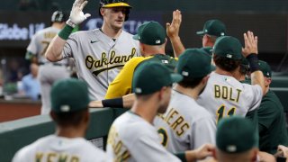 ARLINGTON, TEXAS – AUGUST 17: Sean Murphy #12 of the Oakland Athletics celebrates after hitting a solo home run against the Texas Rangers in the top of the first inning at Globe Life Field on August 17, 2022 in Arlington, Texas. (Photo by Tom Pennington/Getty Images)