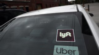 Rideshare drivers demonstrate against rideshare companies Uber and Lyft during a car caravan protest on August 6, 2020 in Los Angeles. – The drivers, organized by the Mobile Workers Alliance and Rideshare Drivers United unions, say Uber and Lyft’s are pushing a “deceptive” November ballot initiative, which, if passed, they claim would “rewrite labor law” and turn app-based drivers into independent contractors, exempting companies such as Lyft and Uber from standard wage and hour restrictions. (Photo by Robyn Beck / AFP) (Photo by ROBYN BECK/AFP via Getty Images)