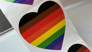 Lgbtq+ pride stripes in the shape of a heart