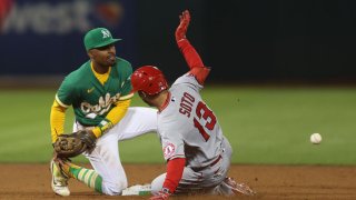 OAKLAND, CALIFORNIA – OCTOBER 04: Livan Soto #13 of the Los Angeles Angels reaches second base as Tony Kemp #5 of the Oakland Athletics is unable to gather the ball in the top of the ninth inning at RingCentral Coliseum on October 04, 2022 in Oakland, California. (Photo by Lachlan Cunningham/Getty Images)