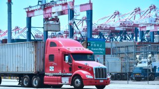 A container delivery truck heads for one of the terminals at the Port of Long Beach in Long Beach, California.