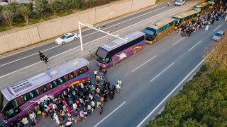After a Covid outbreak at a Foxconn factory in Zhengzhou, China, some workers chose to go home. Pictured here are the shuttle buses on Oct. 30, 2022.