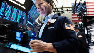 Traders work on the floor of the New York Stock Exchange (NYSE) on November 29, 2022 in New York City.