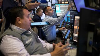 Traders work on the floor of the New York Stock Exchange (NYSE) in New York, US, on Wednesday, Nov. 9, 2022. 
