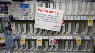 A sign is placed near the section for children’s medicine, Monday, Dec.19, 2022 at a Walgreens, in New York, United States.