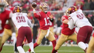 Brock Purdy #13 of the San Francisco 49ers throws a pass.